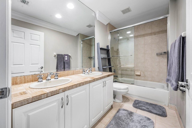 9961 Marsala Way, Delray Beach, FL 33446 - bathroom featuring crown molding, toilet, double vanity, combined bath / shower with glass door, and tile patterned flooring