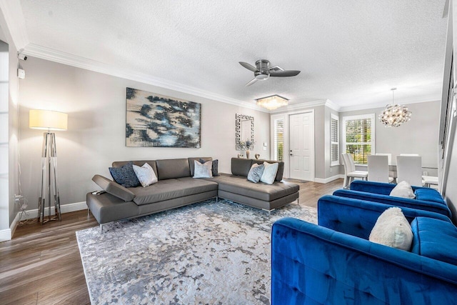 9961 Marsala Way, Delray Beach, FL 33446 - living area with wood finished floors, a ceiling fan, a chandelier, a textured ceiling, and baseboards