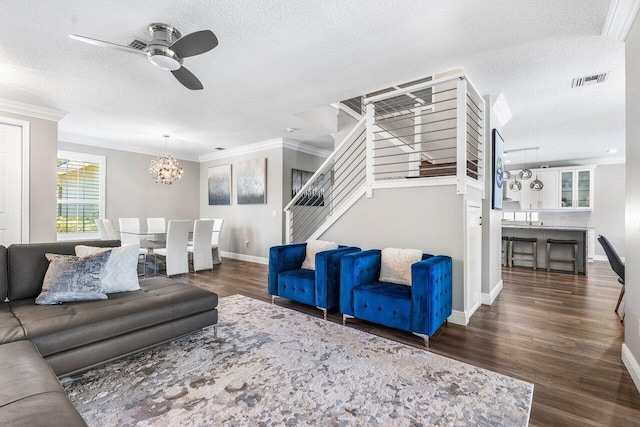 9961 Marsala Way, Delray Beach, FL 33446 - living area with ornamental molding, stairs, a textured ceiling, ceiling fan, and a chandelier