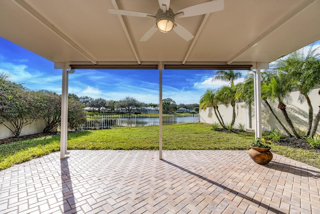 2608 SW Greenwich Way, Palm City, FL 34990 - fenced backyard featuring a water view, a patio area, and a ceiling fan