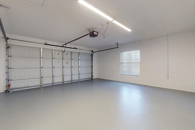 2608 SW Greenwich Way, Palm City, FL 34990 - garage featuring a garage door opener