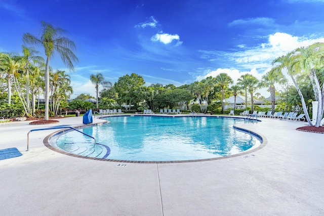 2608 SW Greenwich Way, Palm City, FL 34990 - community pool featuring a patio