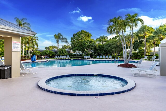 2608 SW Greenwich Way, Palm City, FL 34990 - community pool with a hot tub and a patio