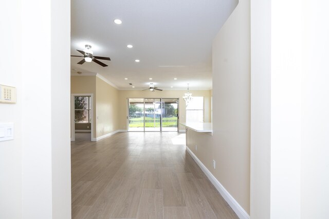2608 SW Greenwich Way, Palm City, FL 34990 - hall featuring recessed lighting, crown molding, and light wood-type flooring