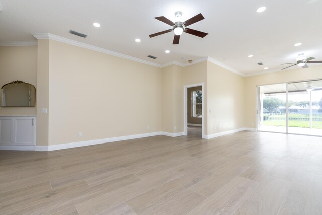 2608 SW Greenwich Way, Palm City, FL 34990 - unfurnished living room featuring ceiling fan, recessed lighting, light wood finished floors, and crown molding