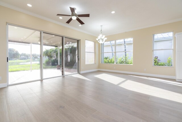 2608 SW Greenwich Way, Palm City, FL 34990 - unfurnished room featuring a chandelier, ceiling fan, crown molding, recessed lighting, and light wood finished floors