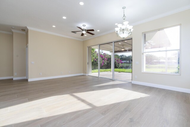 2608 SW Greenwich Way, Palm City, FL 34990 - empty room featuring recessed lighting, light wood-style floors, a chandelier, a ceiling fan, and crown molding