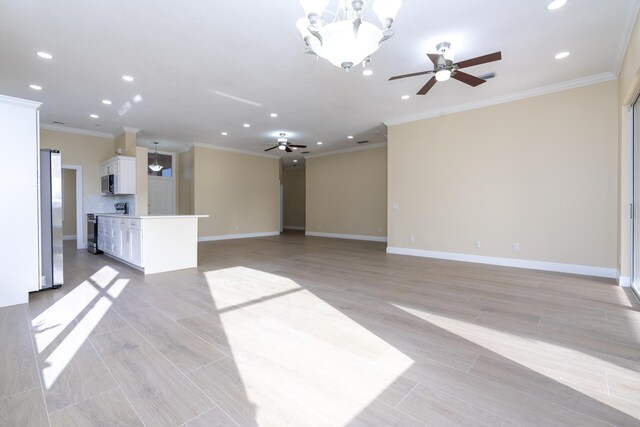2608 SW Greenwich Way, Palm City, FL 34990 - unfurnished living room featuring a ceiling fan, recessed lighting, crown molding, a chandelier, and light wood finished floors