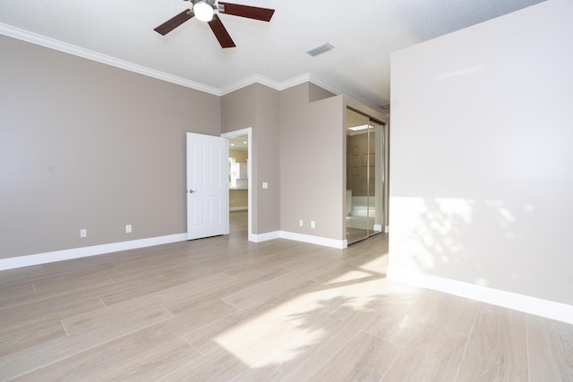 2608 SW Greenwich Way, Palm City, FL 34990 - spare room featuring ceiling fan, light wood-style flooring, and ornamental molding