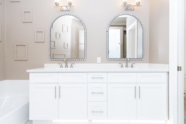 2608 SW Greenwich Way, Palm City, FL 34990 - bathroom with double vanity and a garden tub