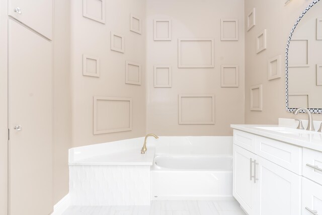 2608 SW Greenwich Way, Palm City, FL 34990 - full bathroom with a garden tub and vanity