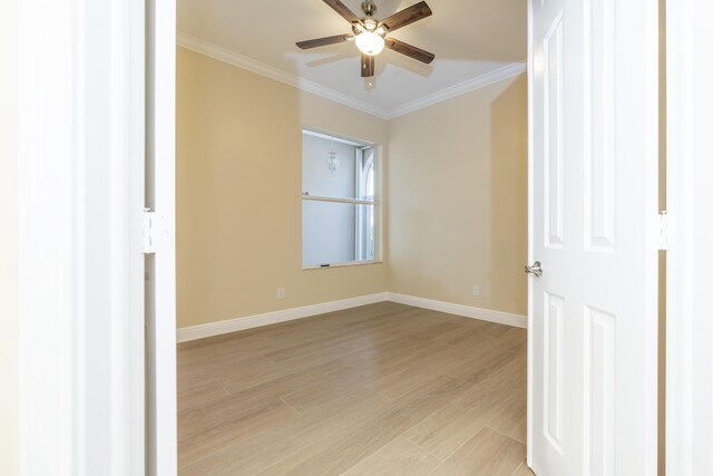 2608 SW Greenwich Way, Palm City, FL 34990 - spare room featuring ornamental molding, ceiling fan, and light wood-style flooring
