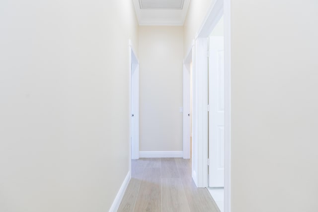2608 SW Greenwich Way, Palm City, FL 34990 - corridor with light wood-style floors and ornamental molding