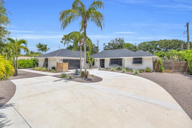 354 Country Club Dr, Tequesta, FL 33469 - view of front of property featuring driveway and stucco siding