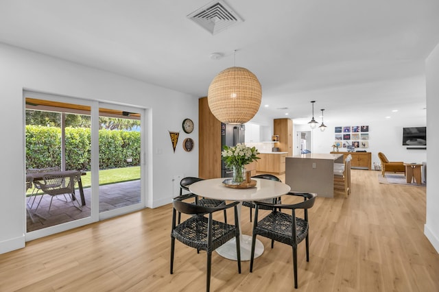 354 Country Club Dr, Tequesta, FL 33469 - dining room with light wood-style flooring, recessed lighting, and baseboards
