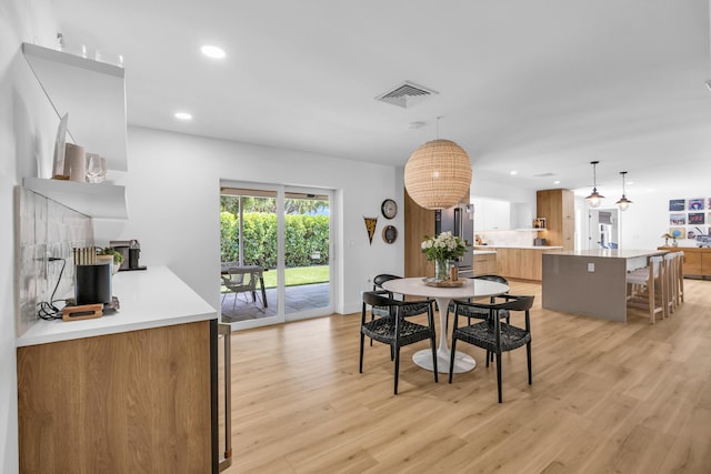 354 Country Club Dr, Tequesta, FL 33469 - dining area featuring light wood-type flooring and recessed lighting