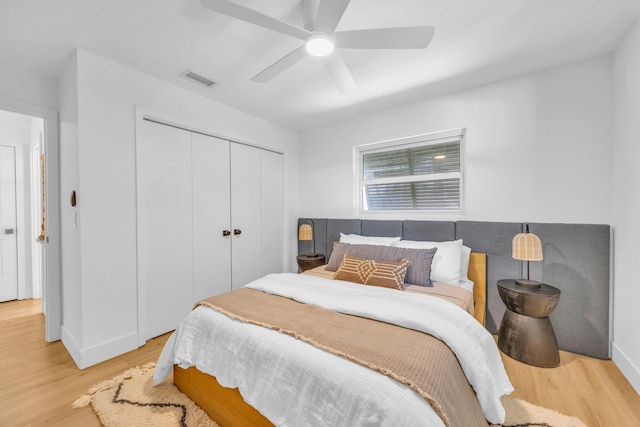 354 Country Club Dr, Tequesta, FL 33469 - bedroom featuring light wood finished floors, a closet, a ceiling fan, and baseboards