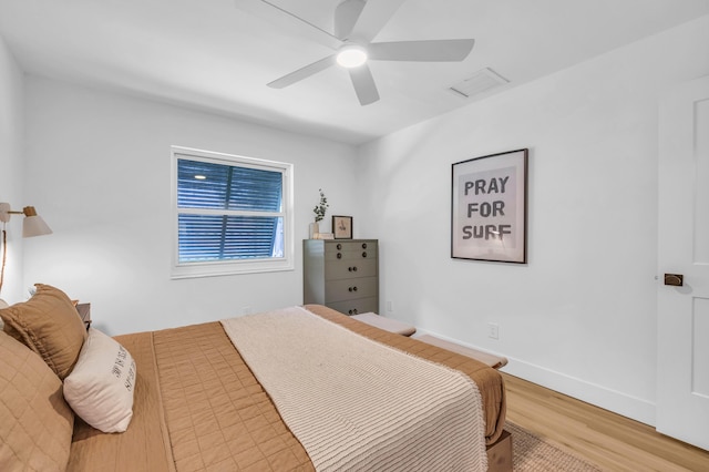 354 Country Club Dr, Tequesta, FL 33469 - bedroom with wood finished floors and a ceiling fan