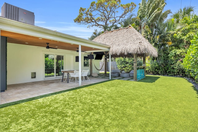 354 Country Club Dr, Tequesta, FL 33469 - view of yard with a ceiling fan and a patio area