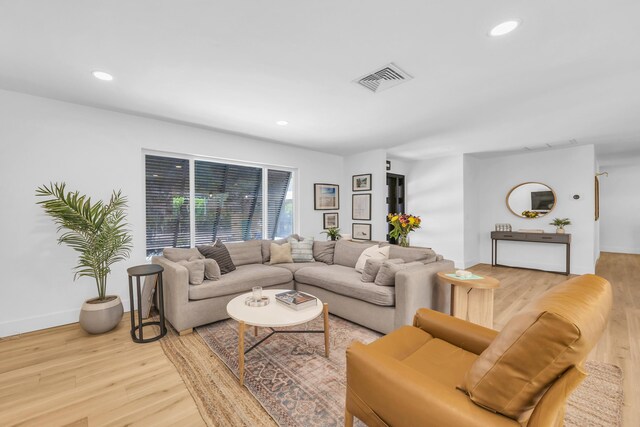 354 Country Club Dr, Tequesta, FL 33469 - living area with light wood finished floors, recessed lighting, and baseboards