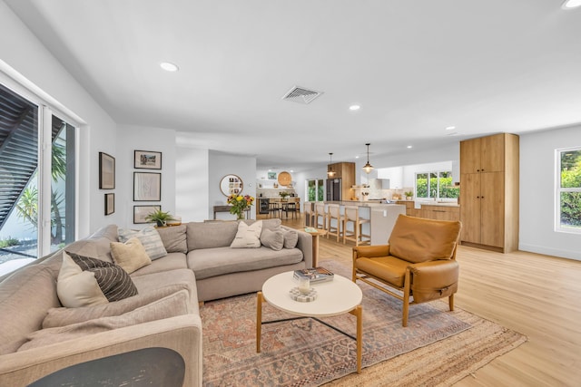 354 Country Club Dr, Tequesta, FL 33469 - living area featuring light wood-type flooring and recessed lighting