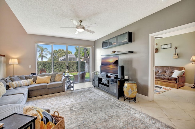 1503 NW 159th Ln, Pembroke Pines, FL 33028 - living room featuring light tile patterned flooring, a ceiling fan, a textured ceiling, and baseboards