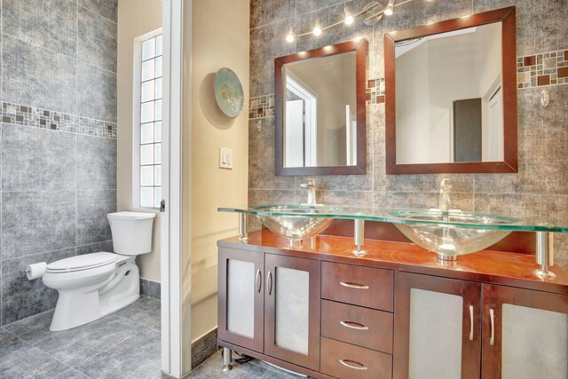 1503 NW 159th Ln, Pembroke Pines, FL 33028 - bathroom with tile walls, double vanity, tile patterned floors, toilet, and baseboards