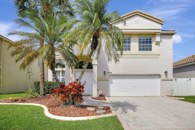 1503 NW 159th Ln, Pembroke Pines, FL 33028 - view of front of home with stucco siding, a garage, decorative driveway, and a tiled roof