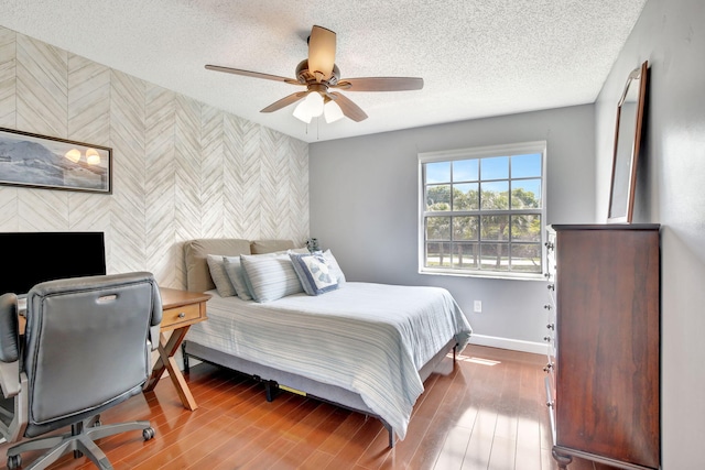 1503 NW 159th Ln, Pembroke Pines, FL 33028 - bedroom featuring an accent wall, wallpapered walls, baseboards, a textured ceiling, and ceiling fan