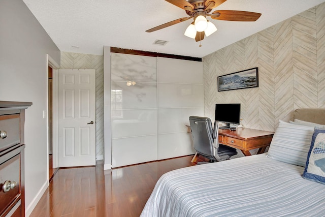 1503 NW 159th Ln, Pembroke Pines, FL 33028 - bedroom with baseboards, wood finished floors, ceiling fan, and a textured ceiling