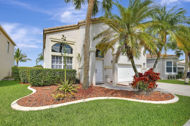1503 NW 159th Ln, Pembroke Pines, FL 33028 - mediterranean / spanish-style house with an attached garage, stucco siding, a front yard, and driveway