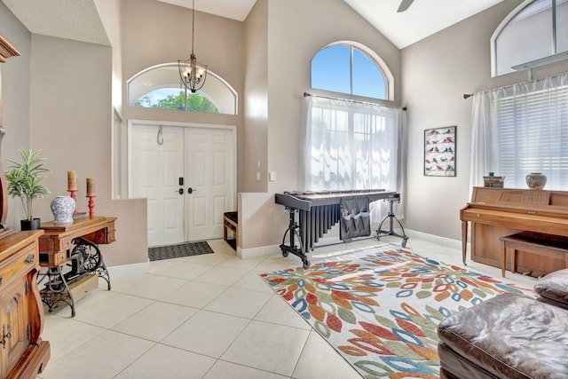 1503 NW 159th Ln, Pembroke Pines, FL 33028 - entrance foyer featuring a chandelier, high vaulted ceiling, tile patterned floors, baseboards, and ceiling fan