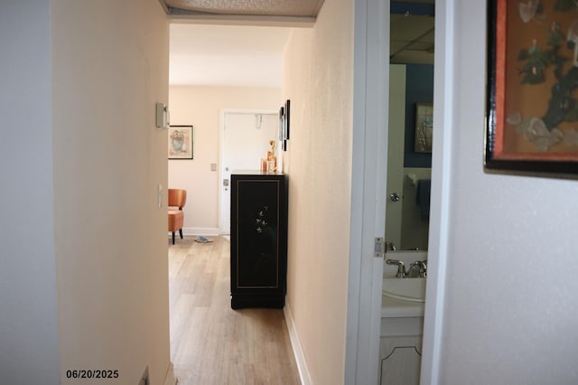 716 Saxony O Unit 716, Delray Beach, FL 33446 - hallway featuring light wood-style floors and baseboards