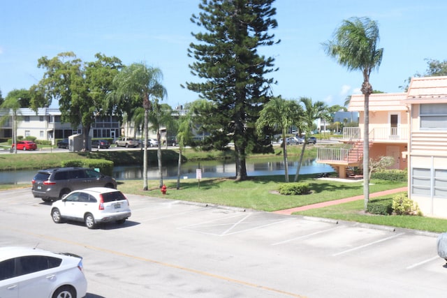 716 Saxony O Unit 716, Delray Beach, FL 33446 - uncovered parking lot featuring a water view