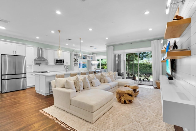 49 Lancaster Rd, Boynton Beach, FL 33426 - living room featuring ornamental molding, recessed lighting, and wood finished floors