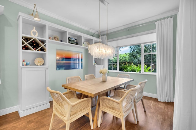 49 Lancaster Rd, Boynton Beach, FL 33426 - dining room featuring ornamental molding, wood finished floors, and a chandelier
