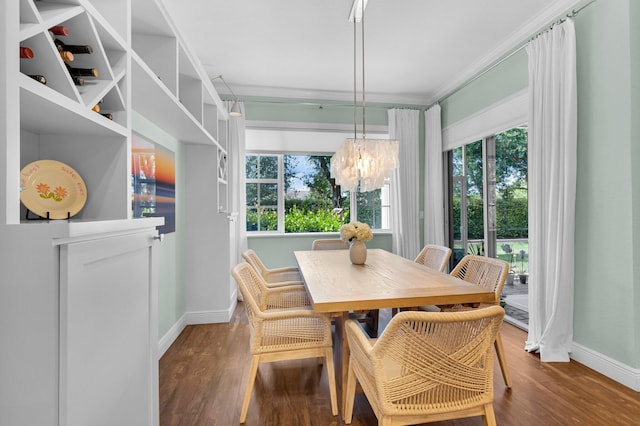 49 Lancaster Rd, Boynton Beach, FL 33426 - dining area featuring a chandelier, wood finished floors, and ornamental molding