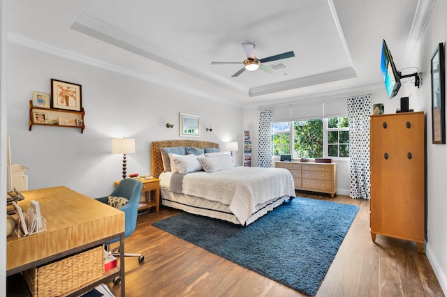 49 Lancaster Rd, Boynton Beach, FL 33426 - bedroom featuring a tray ceiling, wood finished floors, crown molding, and ceiling fan