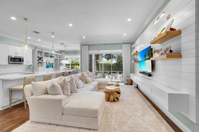 49 Lancaster Rd, Boynton Beach, FL 33426 - living room with crown molding, wood finished floors, and recessed lighting