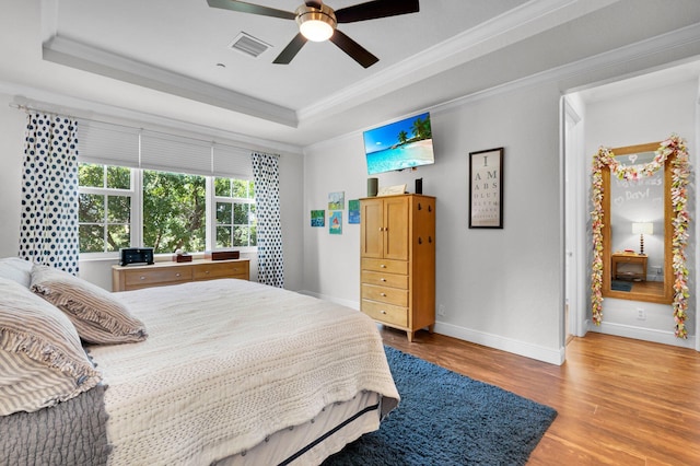 49 Lancaster Rd, Boynton Beach, FL 33426 - bedroom featuring a raised ceiling, wood finished floors, crown molding, and ceiling fan