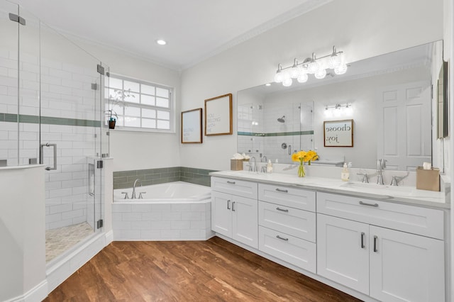 49 Lancaster Rd, Boynton Beach, FL 33426 - full bath featuring double vanity, crown molding, a garden tub, a shower stall, and wood finished floors