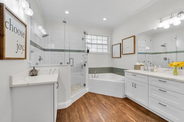 49 Lancaster Rd, Boynton Beach, FL 33426 - bathroom with vanity, a bath, a stall shower, wood finished floors, and ornamental molding