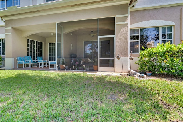 49 Lancaster Rd, Boynton Beach, FL 33426 - rear view of property with stucco siding and a yard