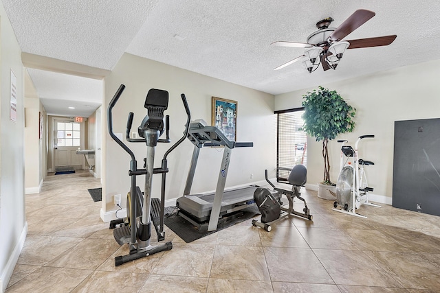 6612 Spring Bottom Way Unit 186, Boca Raton, FL 33433 - exercise area featuring a ceiling fan, a textured ceiling, baseboards, and tile patterned flooring