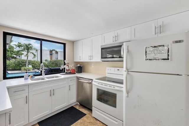 6612 Spring Bottom Way Unit 186, Boca Raton, FL 33433 - kitchen featuring stainless steel appliances, a sink, white cabinetry, and light countertops