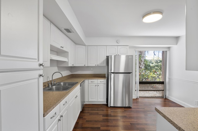 6612 Spring Bottom Way Unit 186, Boca Raton, FL 33433 - kitchen featuring appliances with stainless steel finishes, a sink, dark wood-type flooring, and white cabinetry