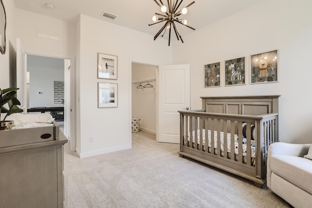 6783 Cobia Cir, Boynton Beach, FL 33437 - bedroom featuring a chandelier, light carpet, a spacious closet, and a closet