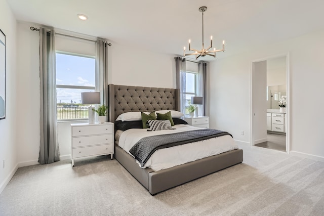 6783 Cobia Cir, Boynton Beach, FL 33437 - carpeted bedroom with a chandelier and connected bathroom