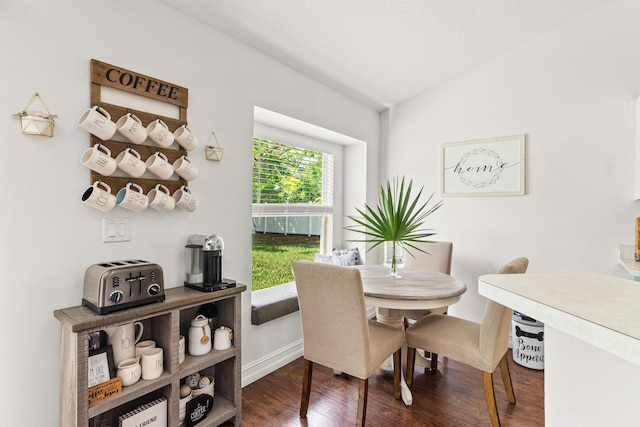1262 SW Hunnicut Ave, Port Saint Lucie, FL 34953 - dining room featuring dark wood-style flooring and baseboards