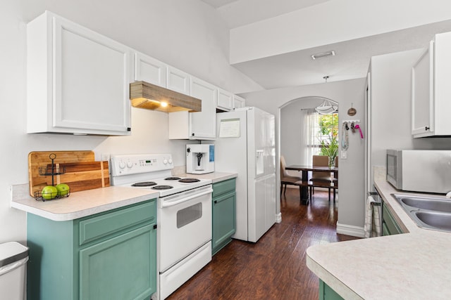 1262 SW Hunnicut Ave, Port Saint Lucie, FL 34953 - kitchen with white appliances, custom range hood, light countertops, dark wood-type flooring, and green cabinetry